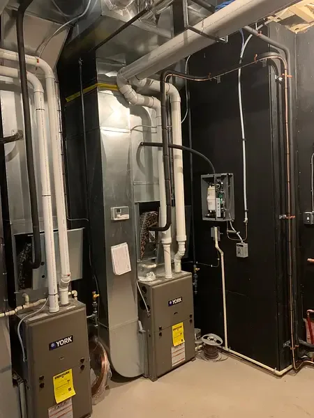 Whole-home humidifier installed on ductwork by Burt’s Breeze